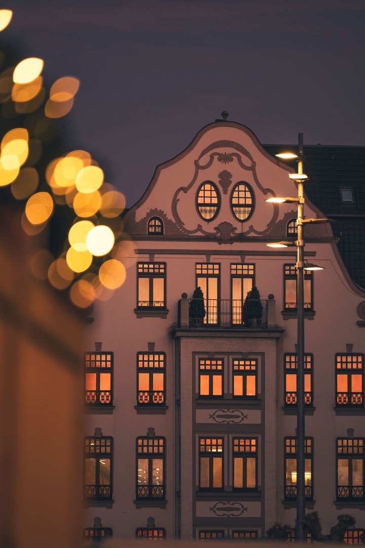 A historic Düsseldorf facade at twilight